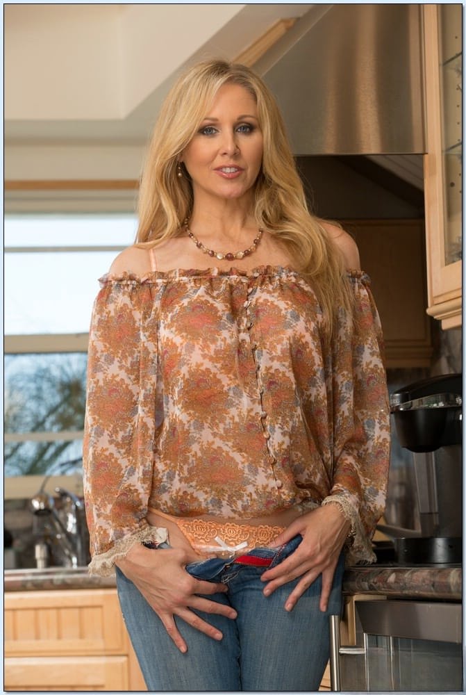 Julia Ann gets naked, huge tits out in kitchen