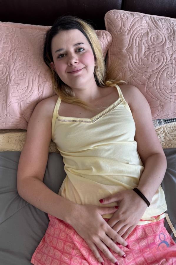 Horny Dez Hansen spreads her pussy on bed