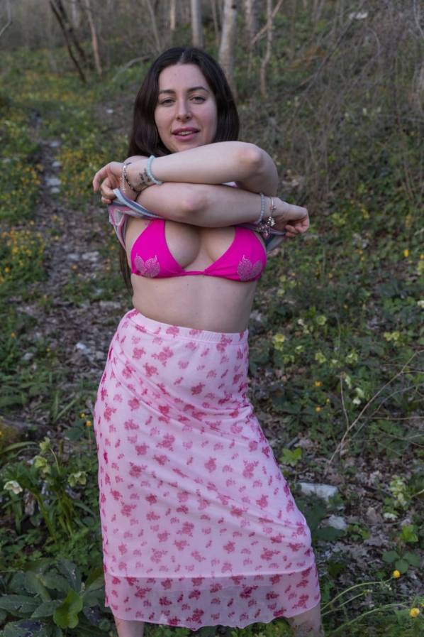 Ally Breelsen strips in the forest and spreads her hairy pussy
