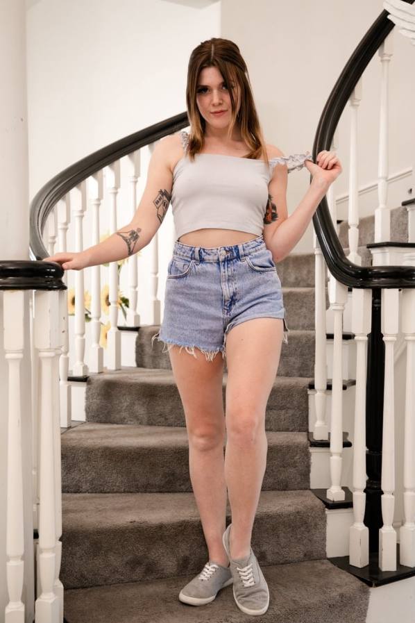 She strips on stairs, kneels to suck his cock