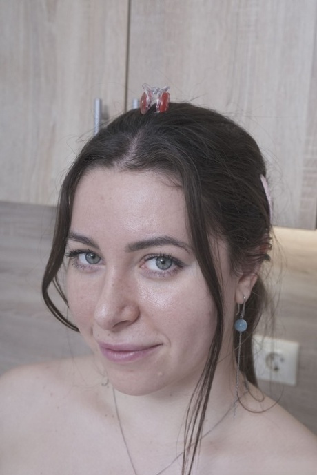 Porn photo : Ally Breelsen strips in the kitchen and rubs her hairy pussy