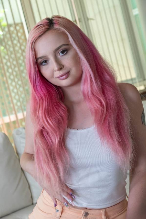 Pink-haired babe with pierced tits sucks cock in POV