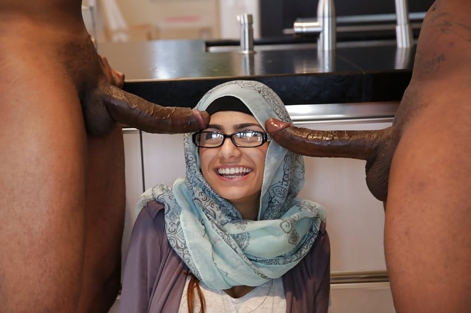 Mia Khalifa's huge tits bounce as two cocks fuck her