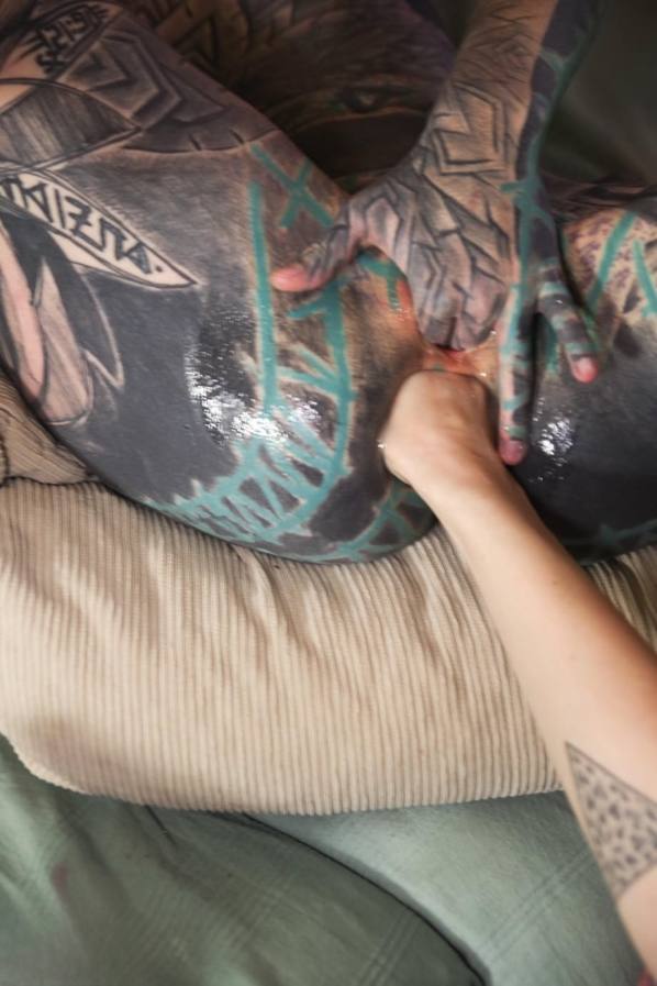 Lover fists gaped anus of tattooed slut