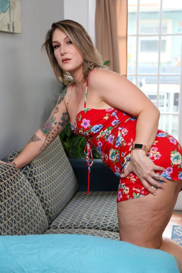 Charley Hart strips red dress, rides hard cock
