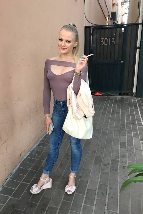 Paris White bares tiny tits and trimmed pussy