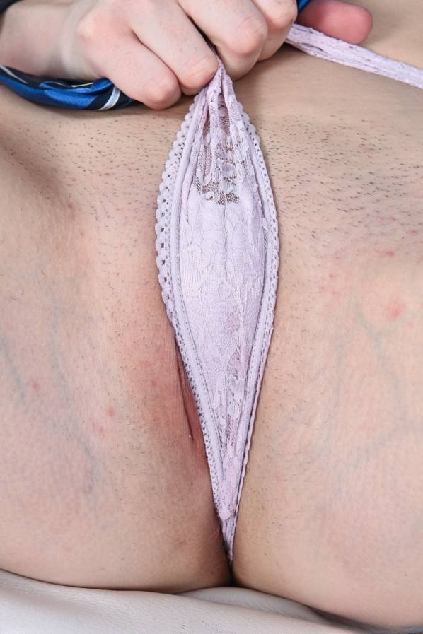 Undressing, blonde Zoe Parker spreads her pink pussy lips