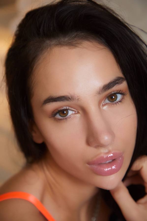 Naked Kama Oxi spreads shaved pussy wide on bed