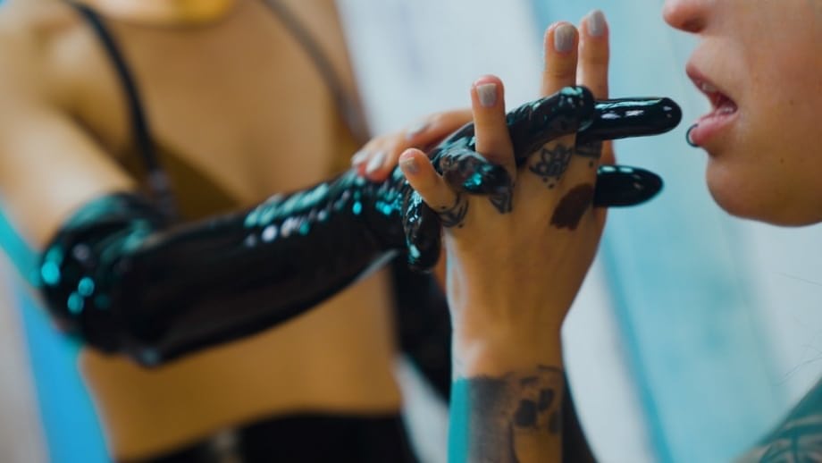 Lesbian in latex gloves toys tattooed brunette's asshole