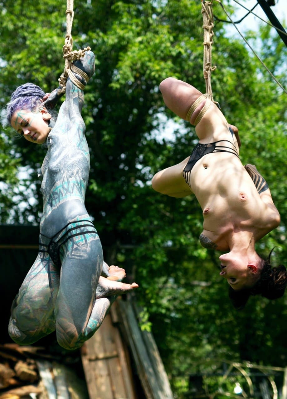 Tits out, hung by rope, getting fucked hard