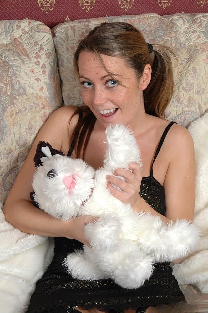 Alexis May strips nude and rubs wet pussy hard