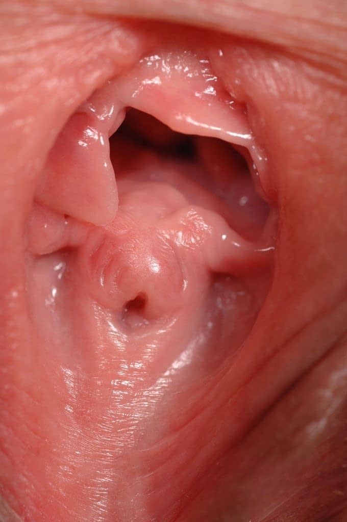Eve Angel spreads wide, pink pussy in closeup