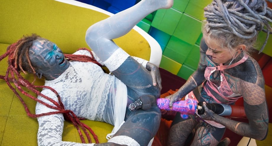 Inked slut straps on to fuck tattooed sissy boy